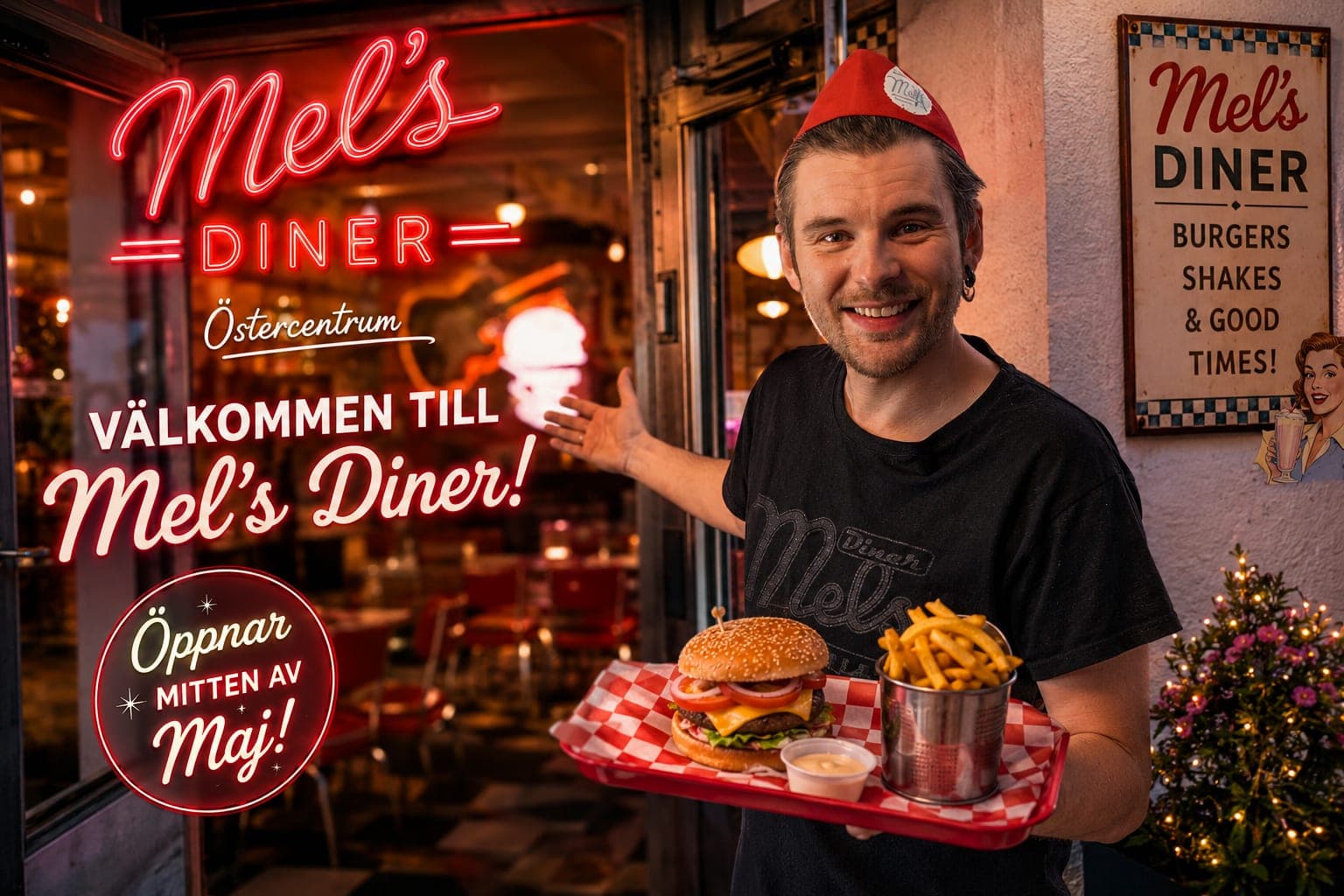 Leende servitör med bricka framför neonskylt i öppningskampanj för Mel's Diner